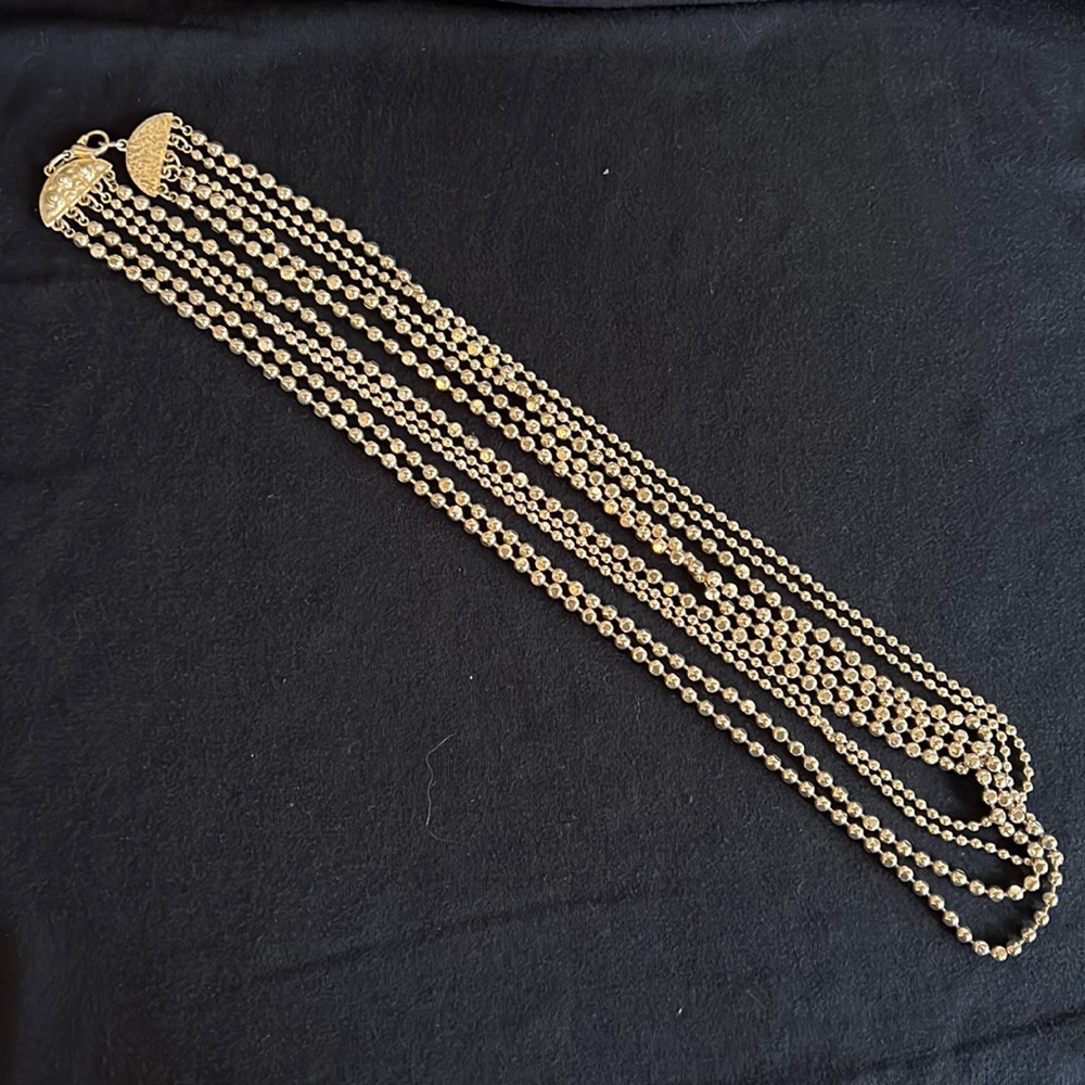 Super cute Silver bead three chain necklace.